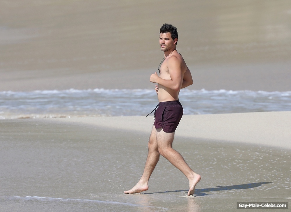 Taylor Lautner Shirtless On The Beach