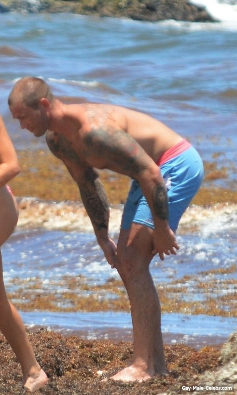 Cole Swindell Sunbathing Shirtless On A Beach