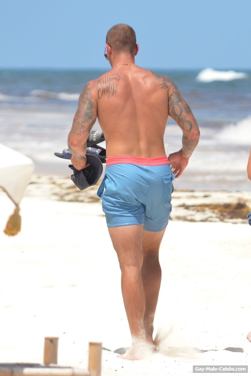 Cole Swindell Sunbathing Shirtless On A Beach