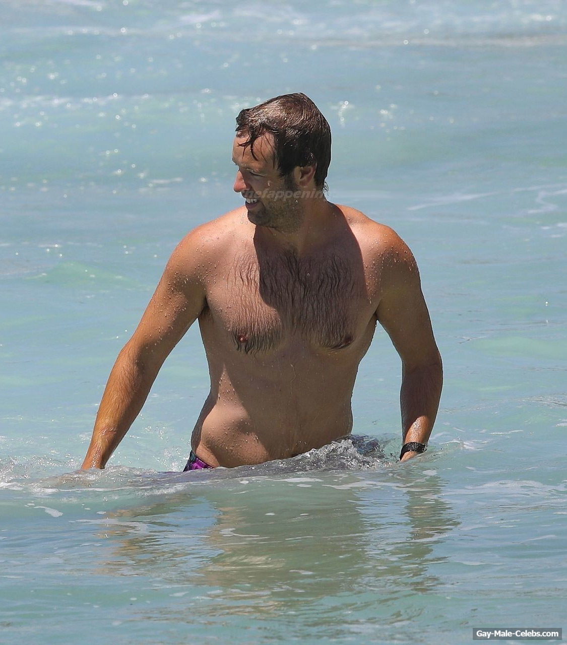 Danny Clayton Sunbathing Shirtless On A Beach