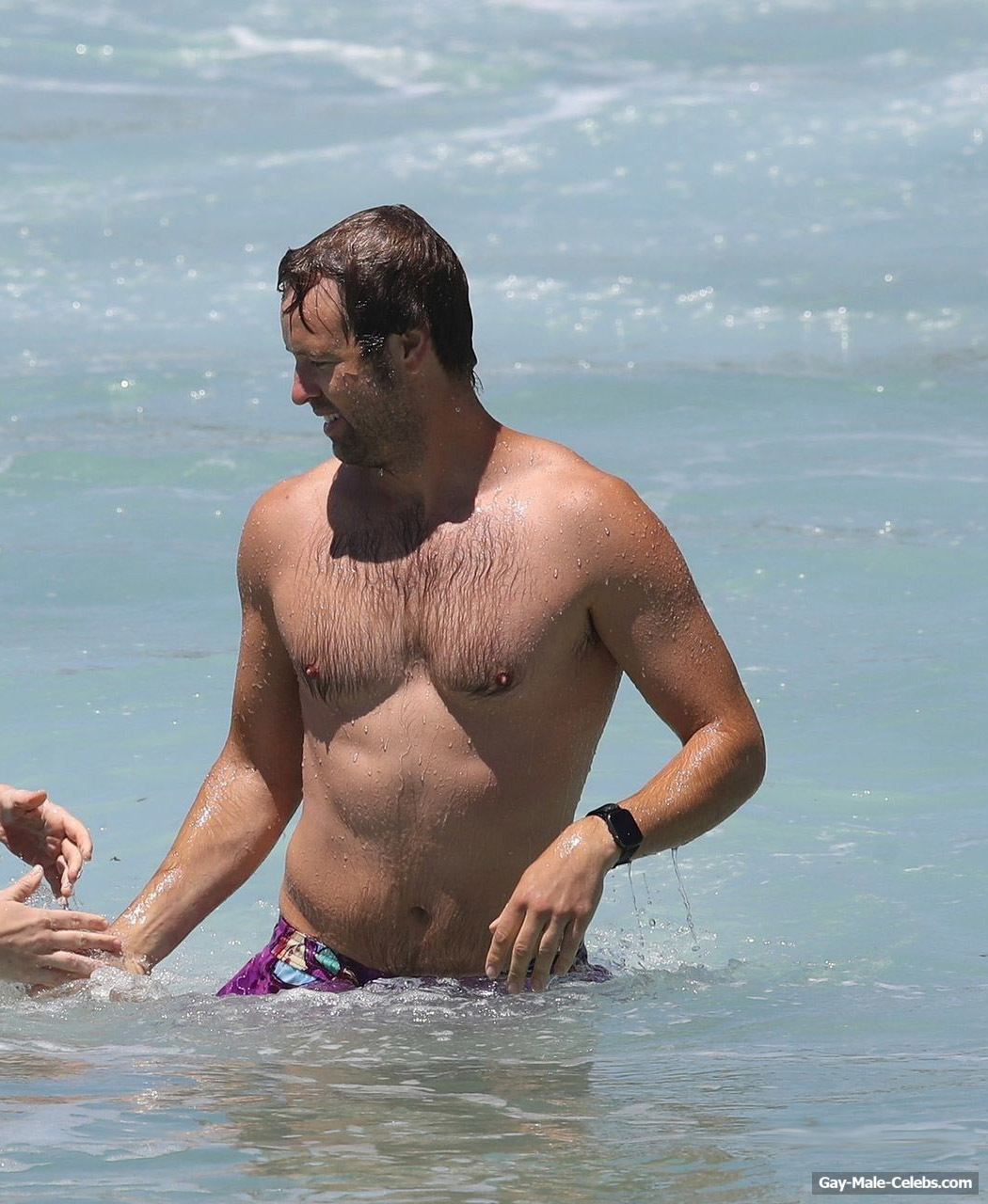 Danny Clayton Sunbathing Shirtless On A Beach