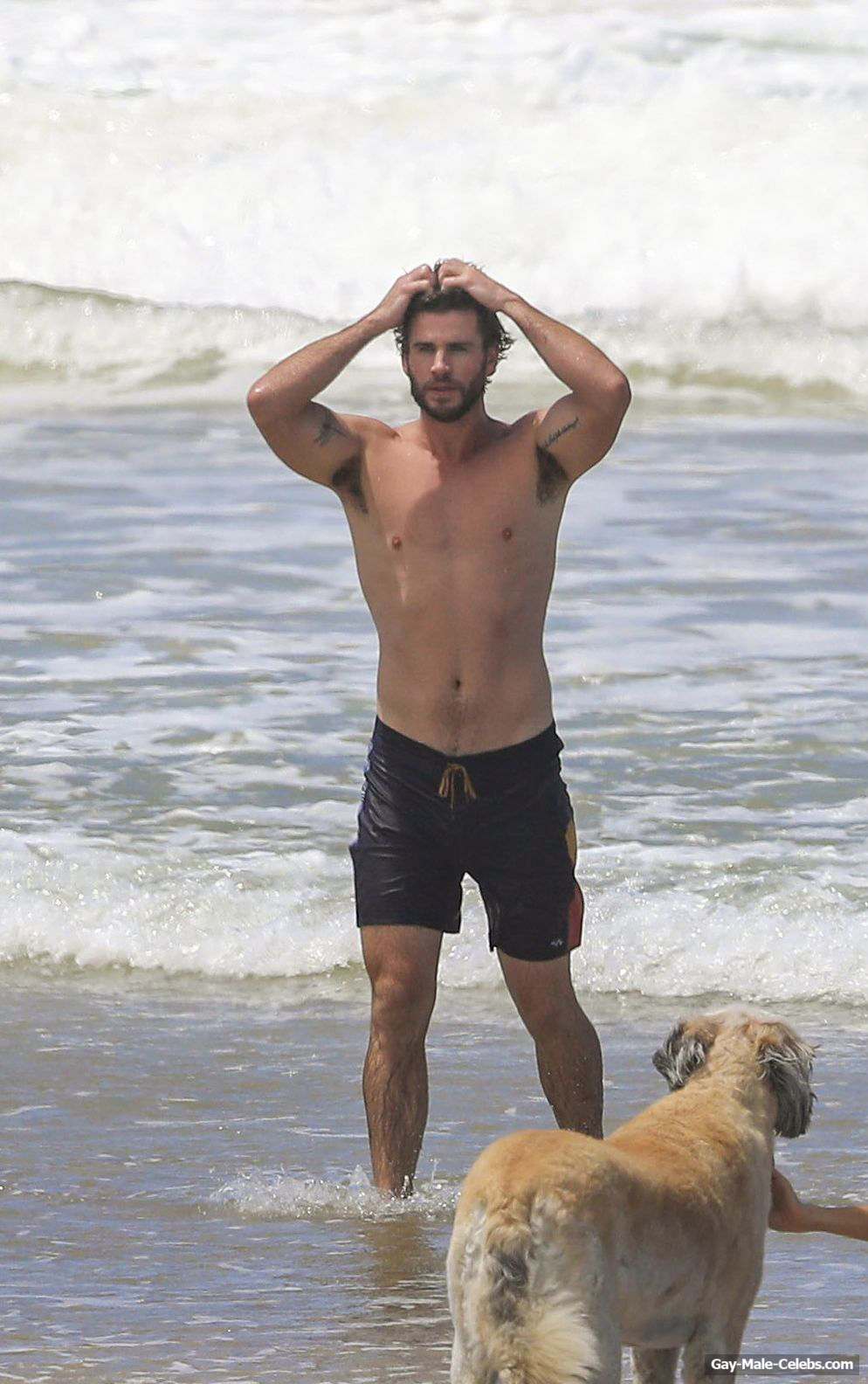 RE: Liam Hemsworth shirtless in wet board shorts trail x12. 