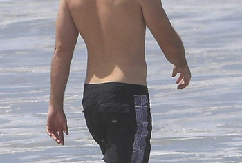 Liam Hemsworth sunbathing