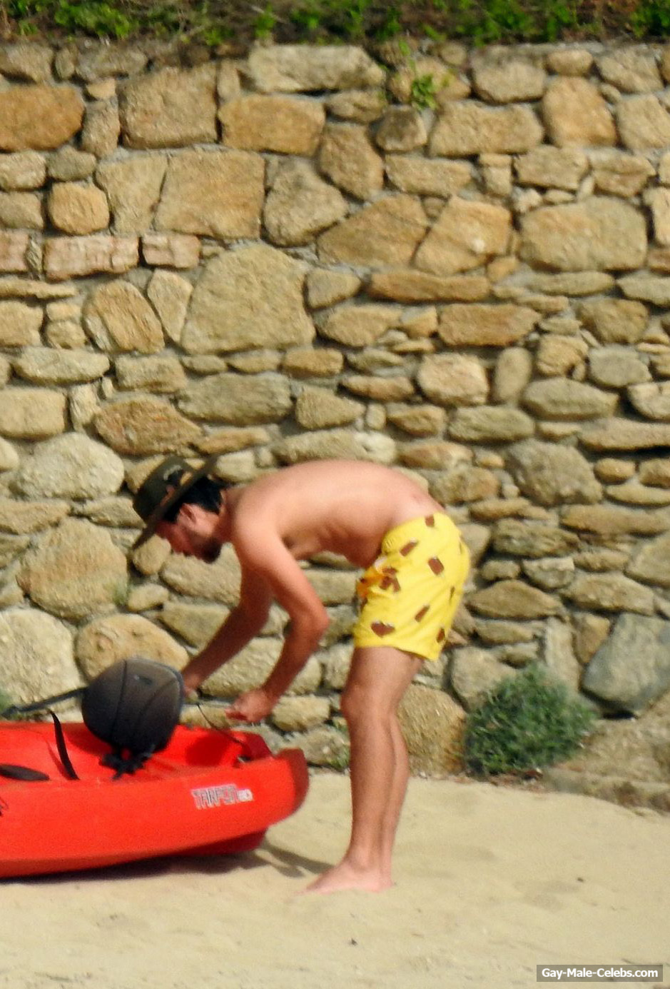 Danny Fujikawa Sunbathing Shirtless On A Beach