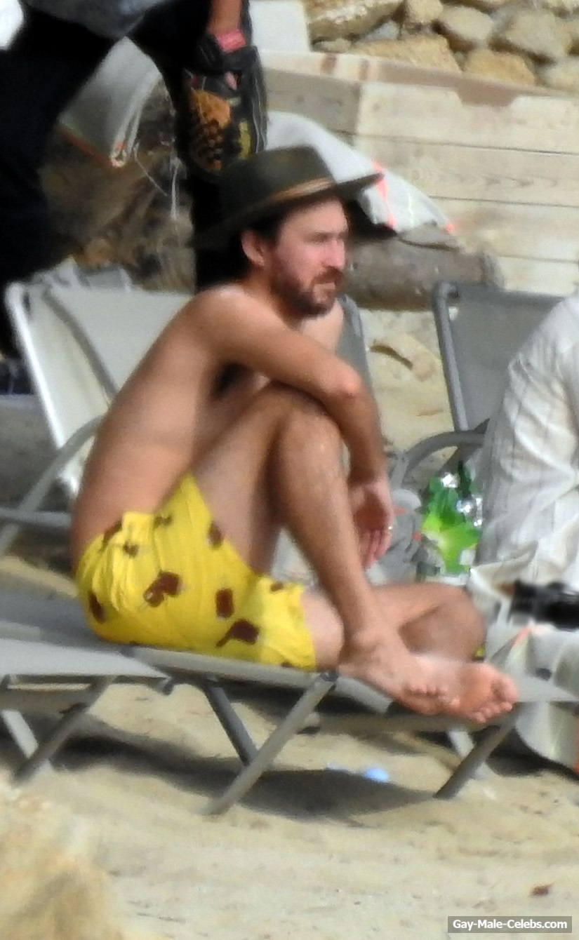 Danny Fujikawa Sunbathing Shirtless On A Beach