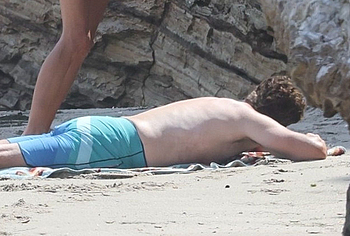 Gerard Butler sunbathing