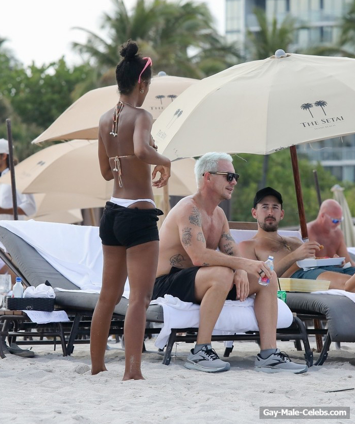 Diplo Shows Off His Great Muscles On A Beach