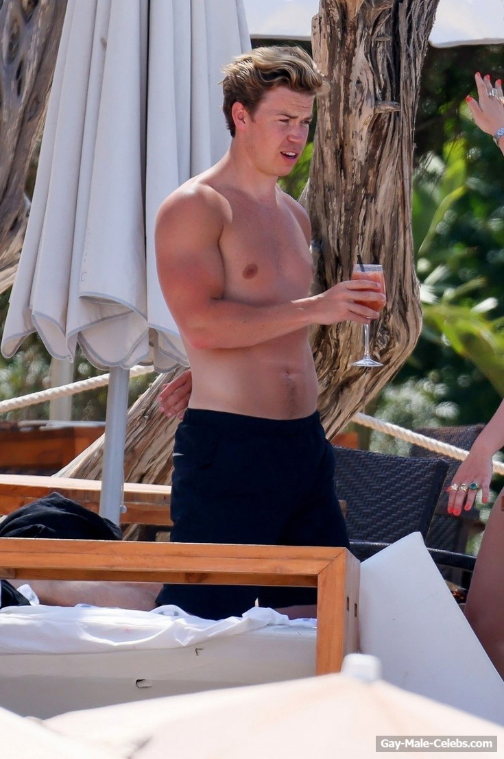 Will Poulter Sunbathing Shirtless On A Beach