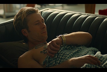 Glen Powell shirtless in Chad Powers