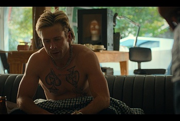 Glen Powell shirtless in Chad Powers