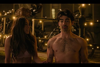 Joe Jonas shirtless in A Very Jonas Christmas Movie