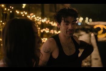 Joe Jonas shirtless in A Very Jonas Christmas Movie
