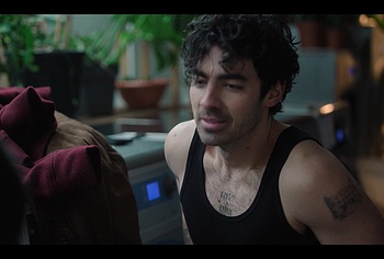 Joe Jonas shirtless in A Very Jonas Christmas Movie