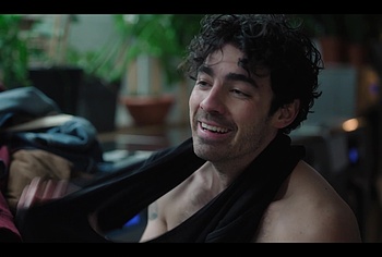 Joe Jonas shirtless in A Very Jonas Christmas Movie