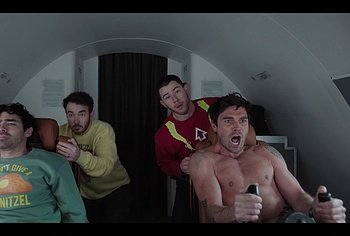 KJ Apa shirtless in A Very Jonas Christmas Movie