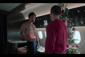 KJ Apa shirtless in A Very Jonas Christmas Movie