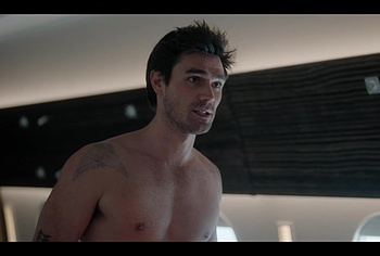 KJ Apa shirtless in A Very Jonas Christmas Movie