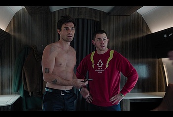 KJ Apa shirtless in A Very Jonas Christmas Movie