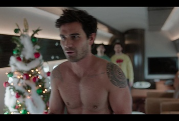 KJ Apa shirtless in A Very Jonas Christmas Movie