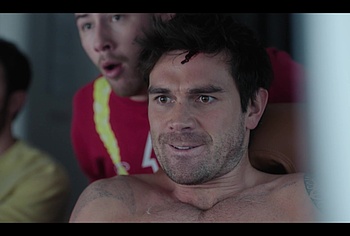 KJ Apa shirtless in A Very Jonas Christmas Movie