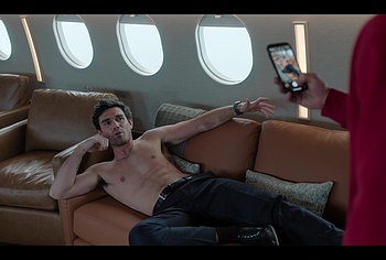 KJ Apa shirtless in A Very Jonas Christmas Movie