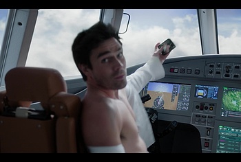 KJ Apa shirtless in A Very Jonas Christmas Movie