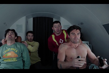 KJ Apa shirtless in A Very Jonas Christmas Movie