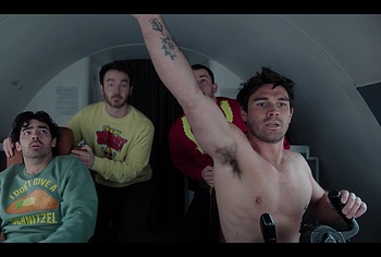 KJ Apa shirtless in A Very Jonas Christmas Movie