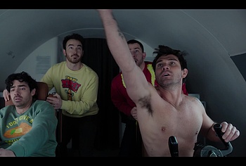 KJ Apa shirtless in A Very Jonas Christmas Movie