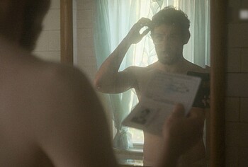 Josh O'Connor shirtless in The Mastermind
