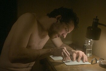 Josh O'Connor shirtless in The Mastermind