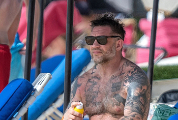 Tom Hardy shirtless on a beach