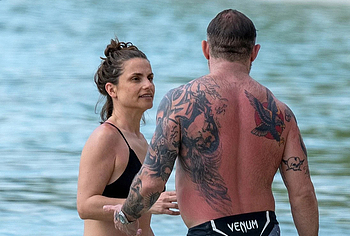 Tom Hardy shirtless on a beach