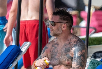 Tom Hardy shirtless on a beach