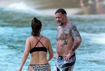 Tom Hardy shirtless on a beach