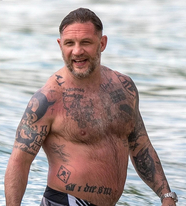 Tom Hardy shirtless on a beach